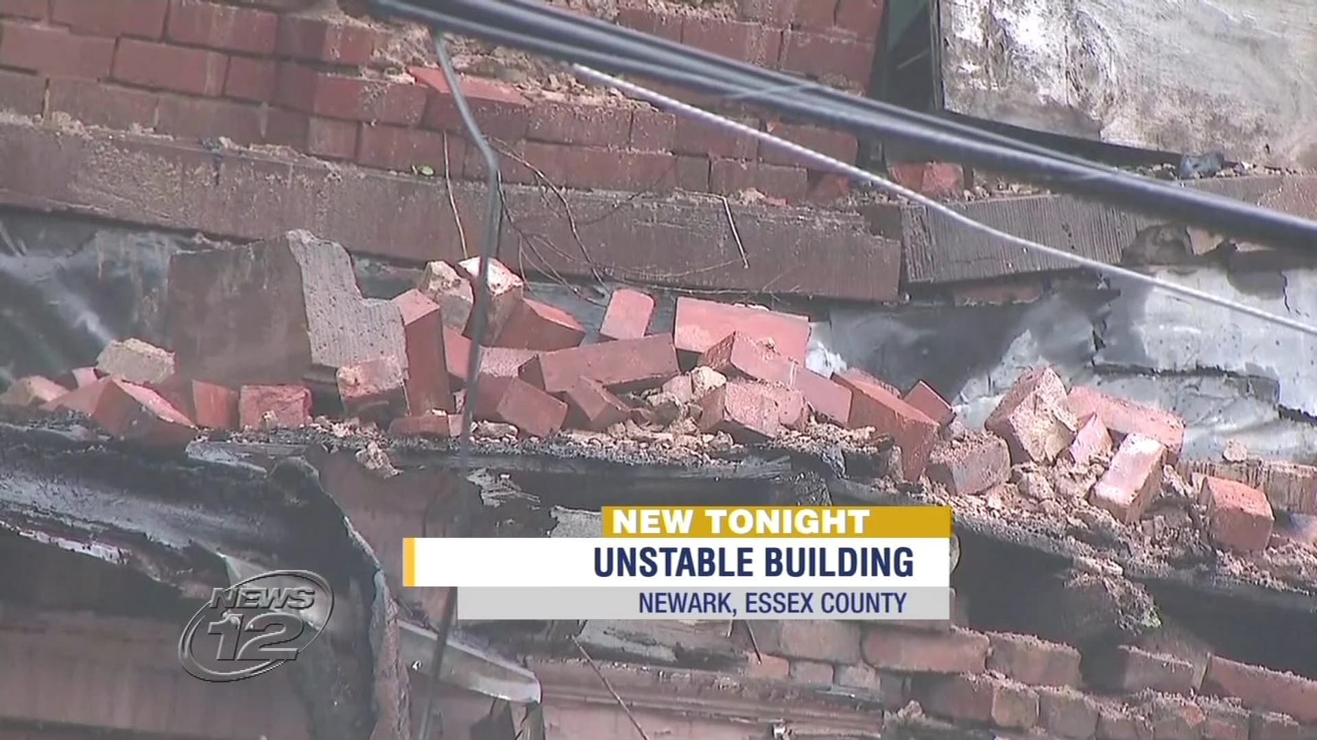 Building crumbles in Newark amid heavy rains