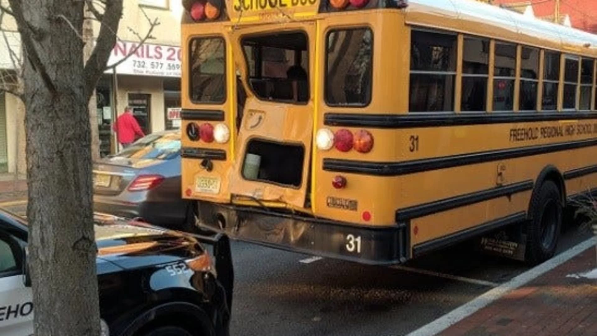 Students checked out by EMTs following recycling truck, school bus crash