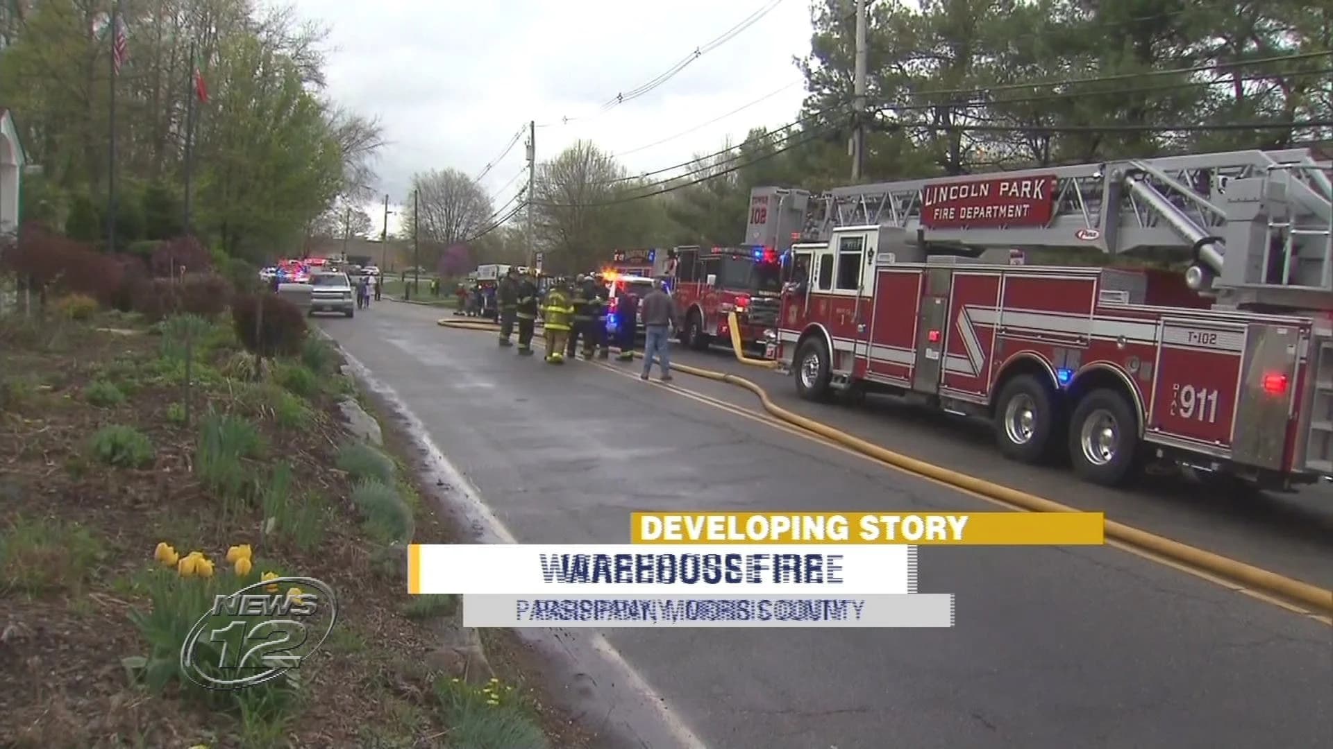 Firefighters clear warehouse fire, road closes