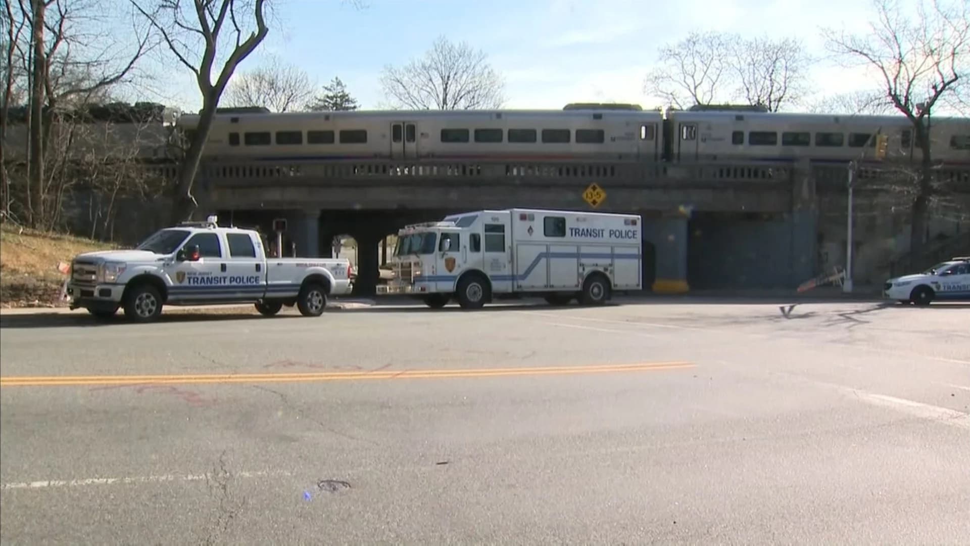 Authorities: Man’s body found hanging from bridge near train station