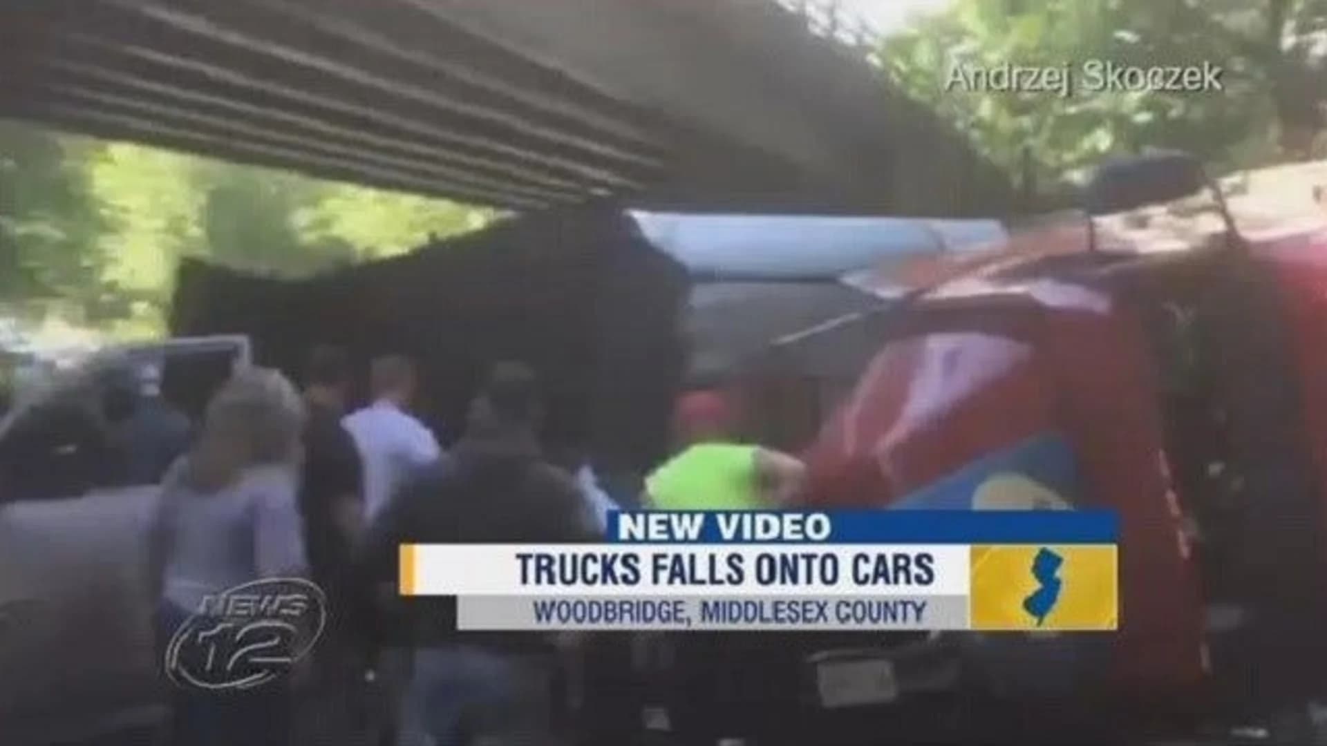 Garbage truck rolls off ramp onto cars, killing man