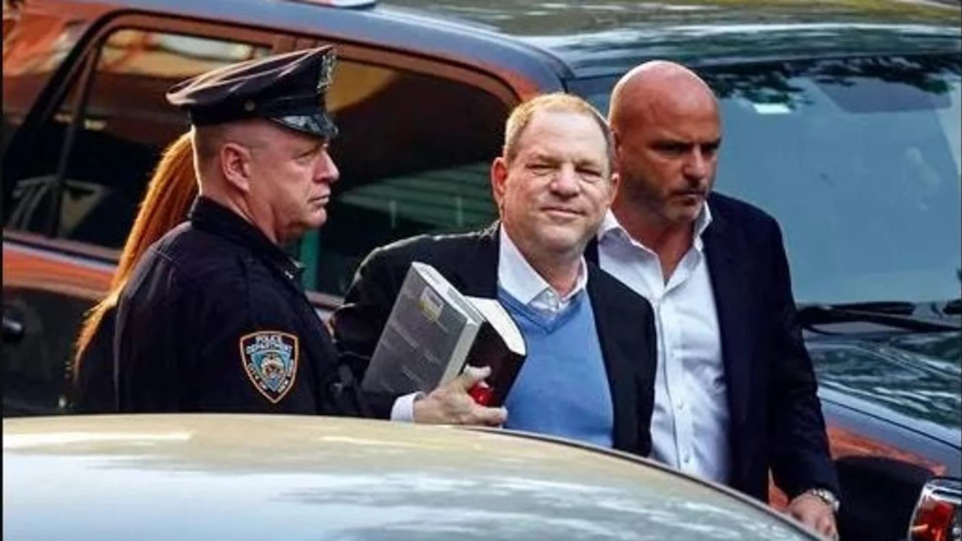 Handcuffed Weinstein faces rape charge in #MeToo reckoning
