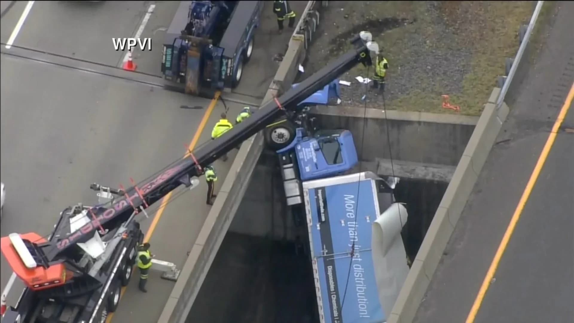 Multivehicle crash on I-195 leaves box truck dangling off overpass