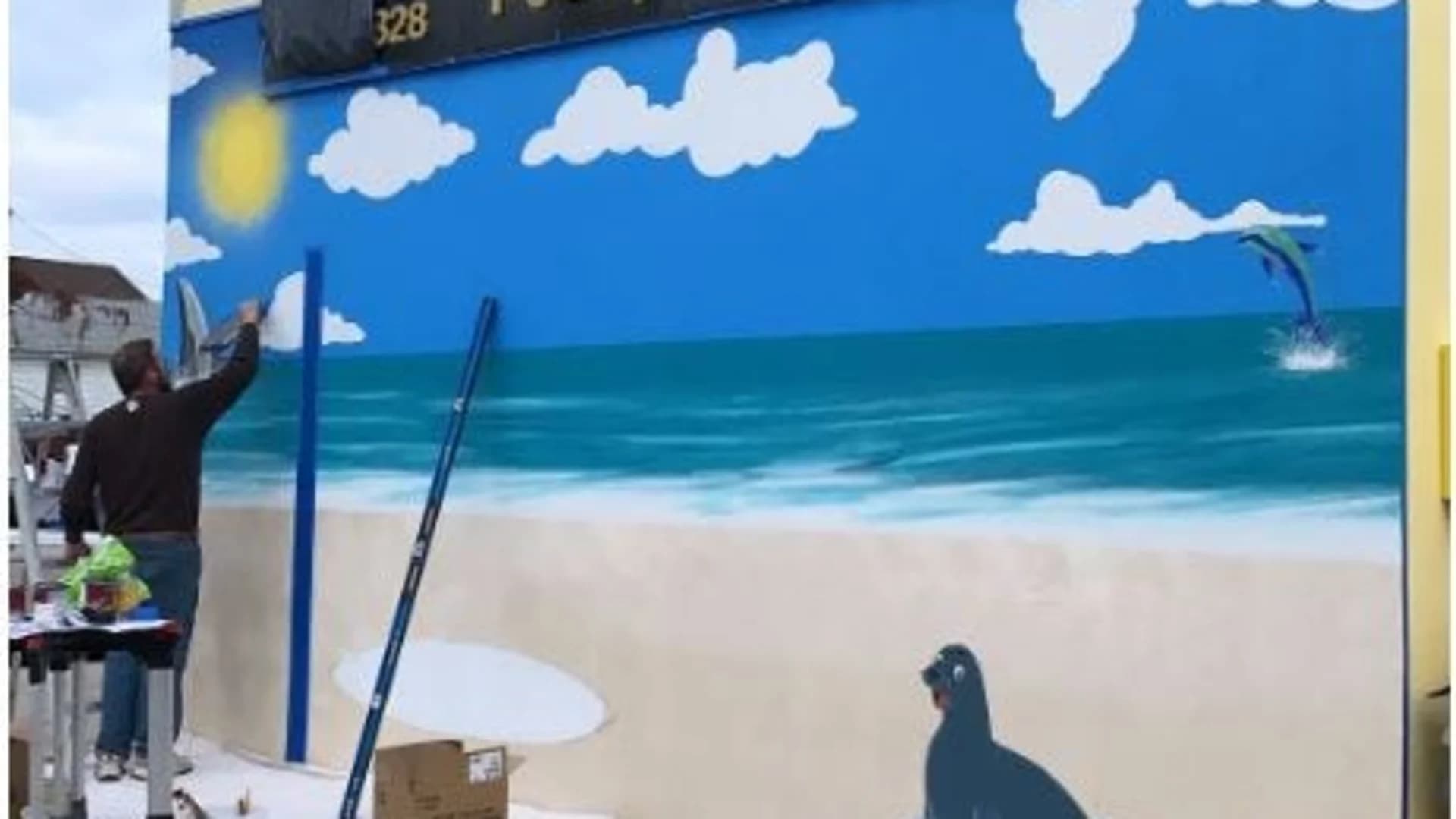 Long Beach real estate company holds live painting event to help beautify city