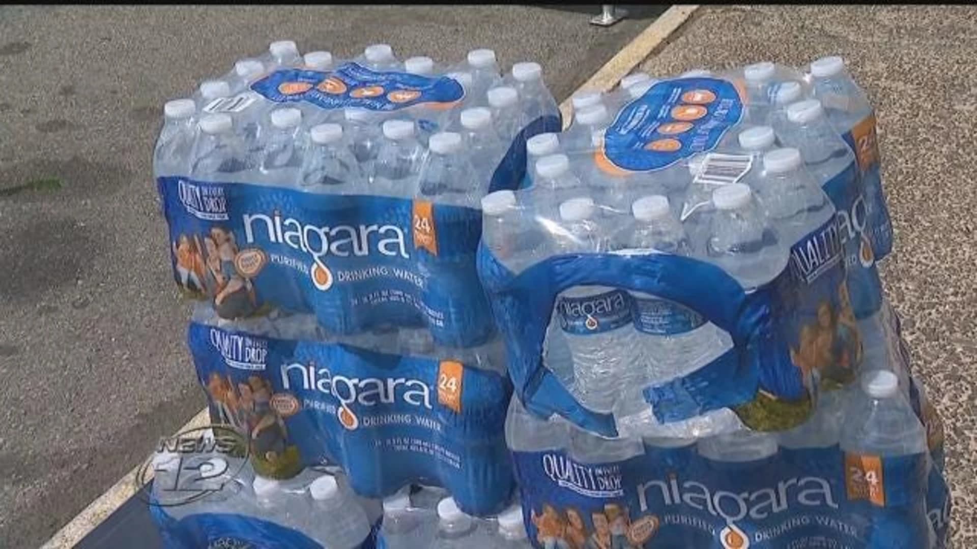 Residents struggle to get safe water from distribution centers in Newark