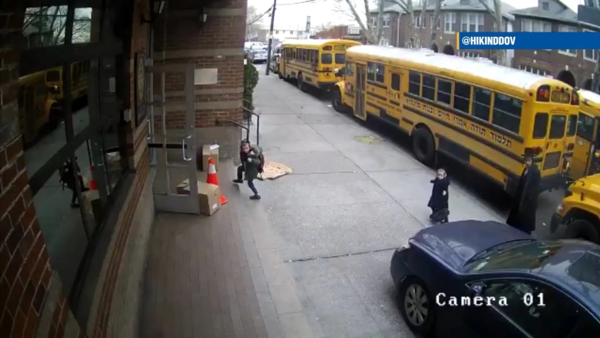 VIDEO: Driver hops curb to get around school buses; kids nearly struck